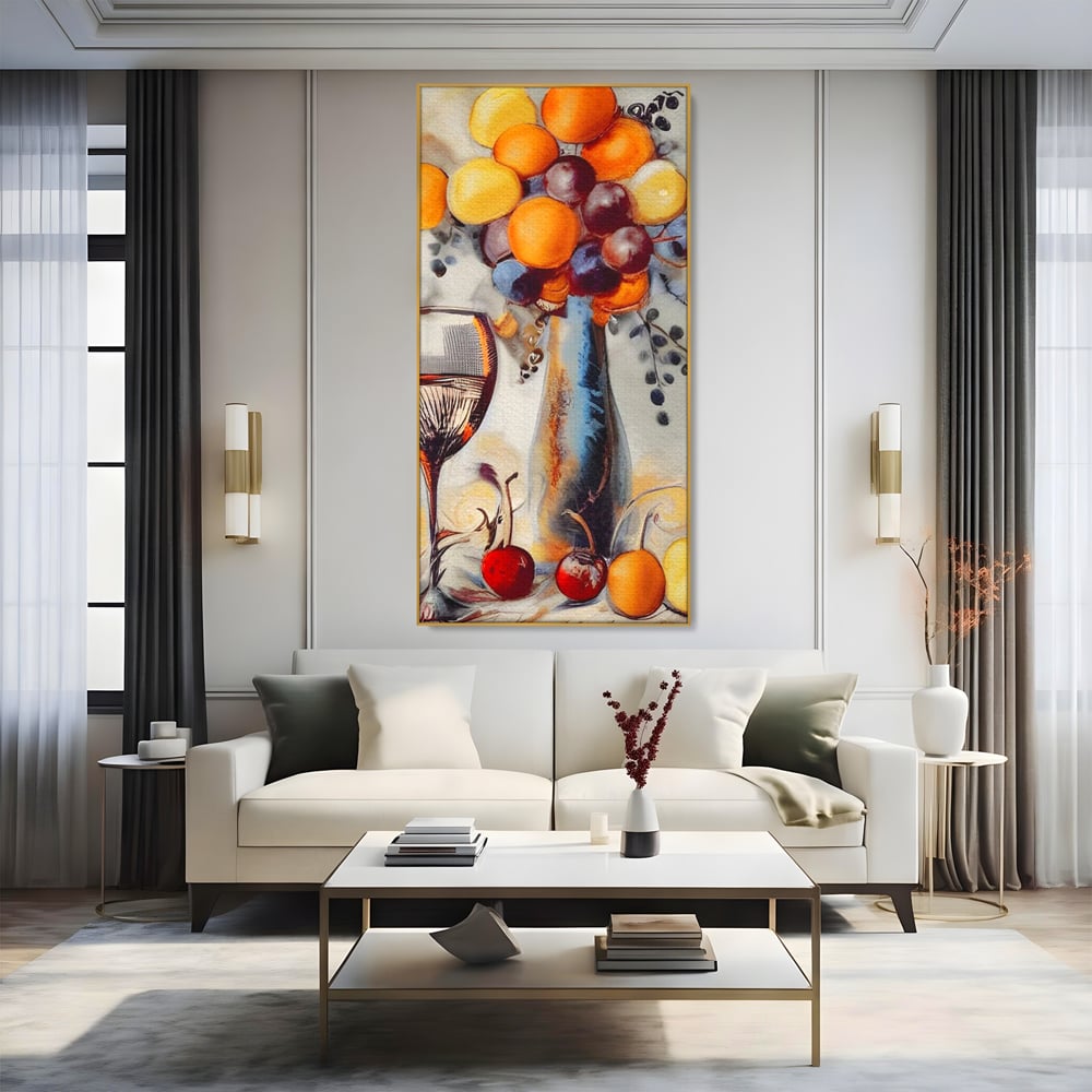 Tablou canvas cu tablou cu sticla, pahar de vin si fructe, in rama de aluminiu auriu, pe perete intr-un living